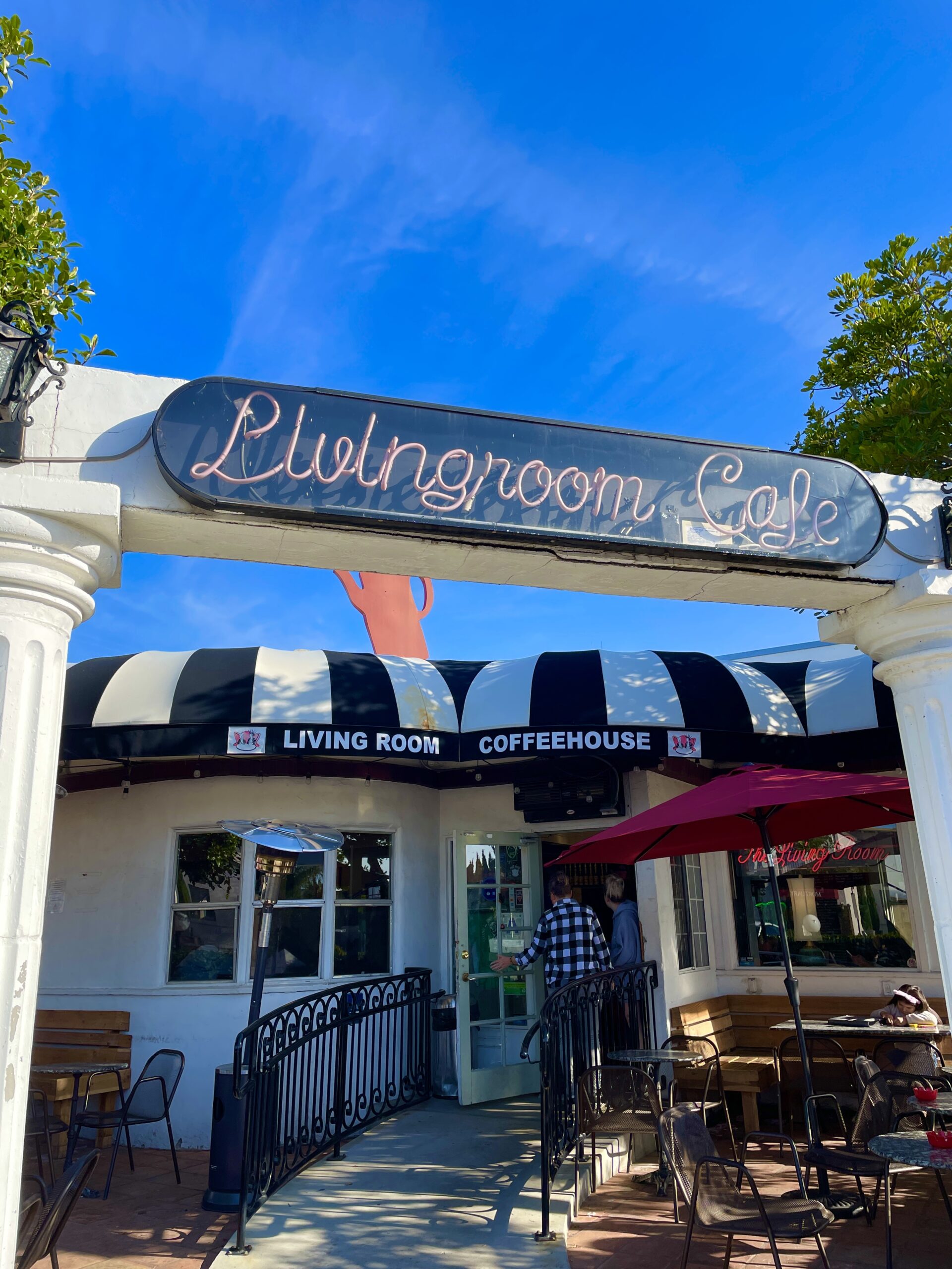 Entrance of Living Room Coffeehouse with a beautiful blue sky backdrop 